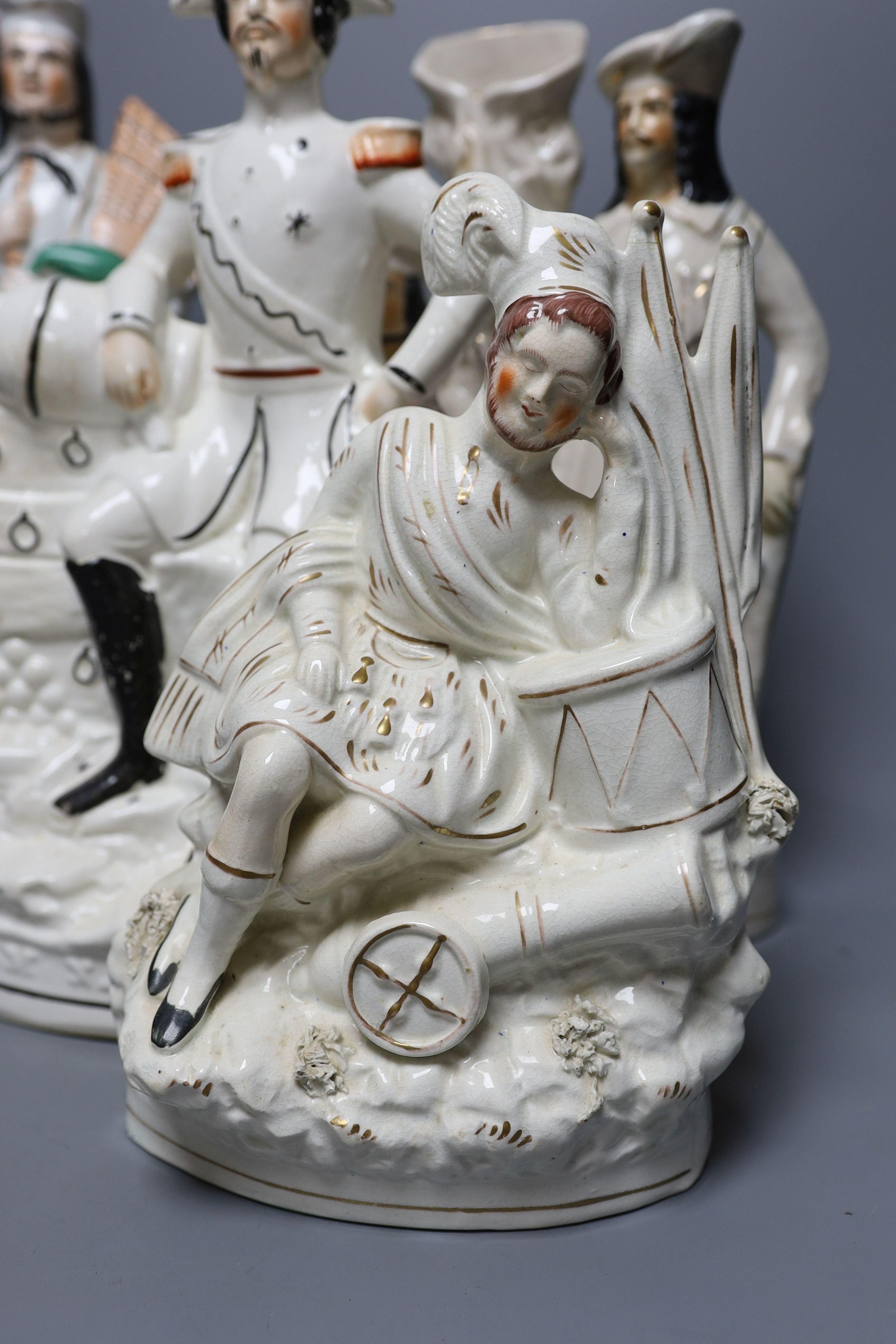 Four 19th century Staffordshire pottery groups - 40cm tall
